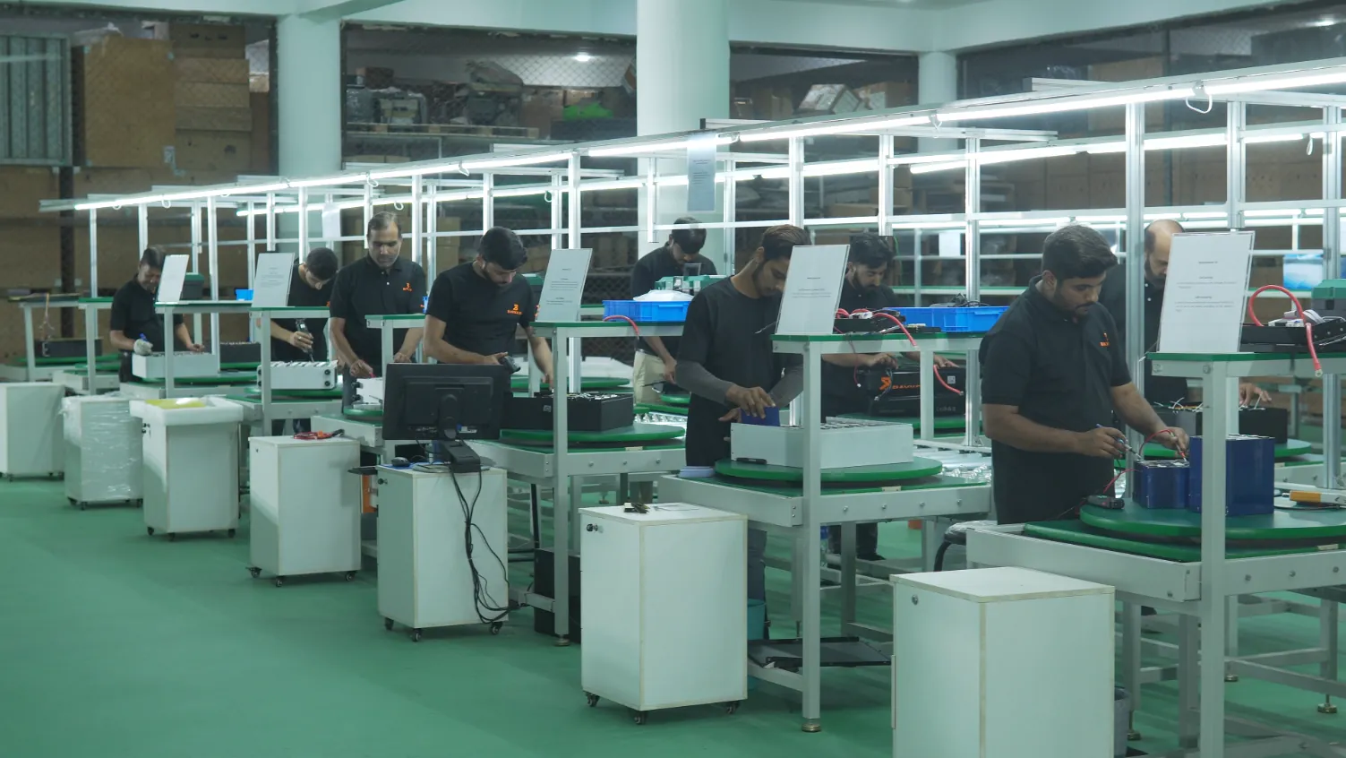Technicians assembling equipment on Baykee's Lahore production line