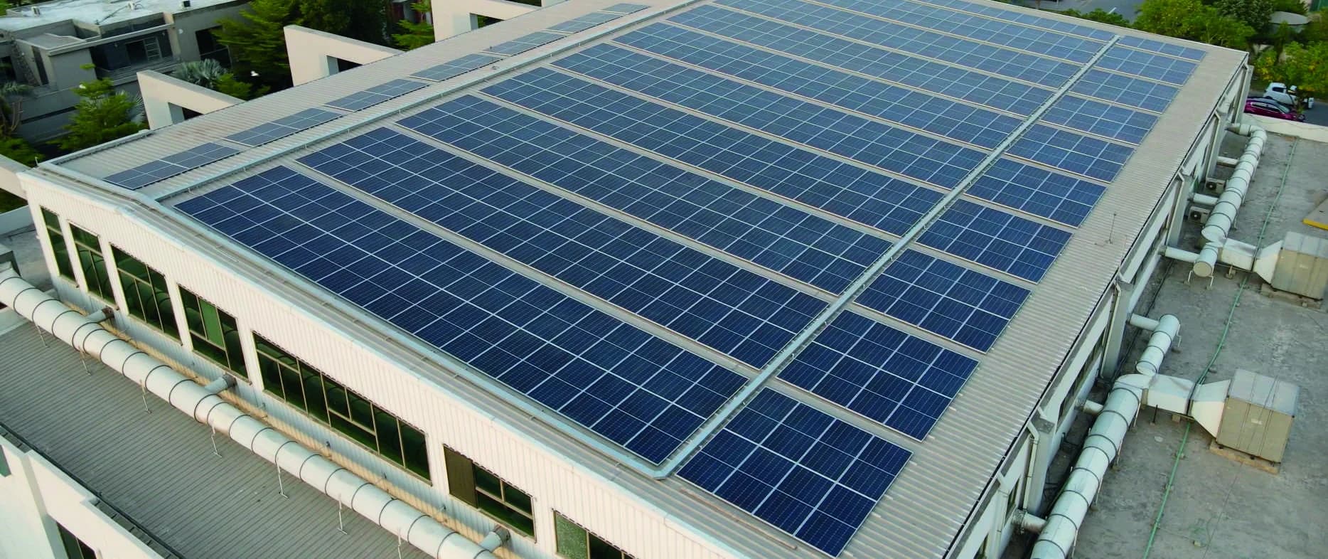 Solar panels installed on a large roof